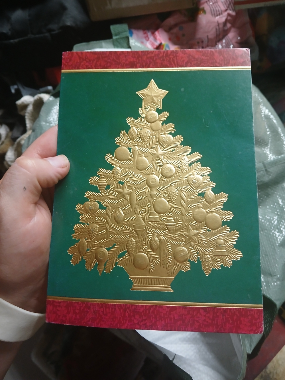 traditional holiday greeting card featuring a gold embossed Christmas tree